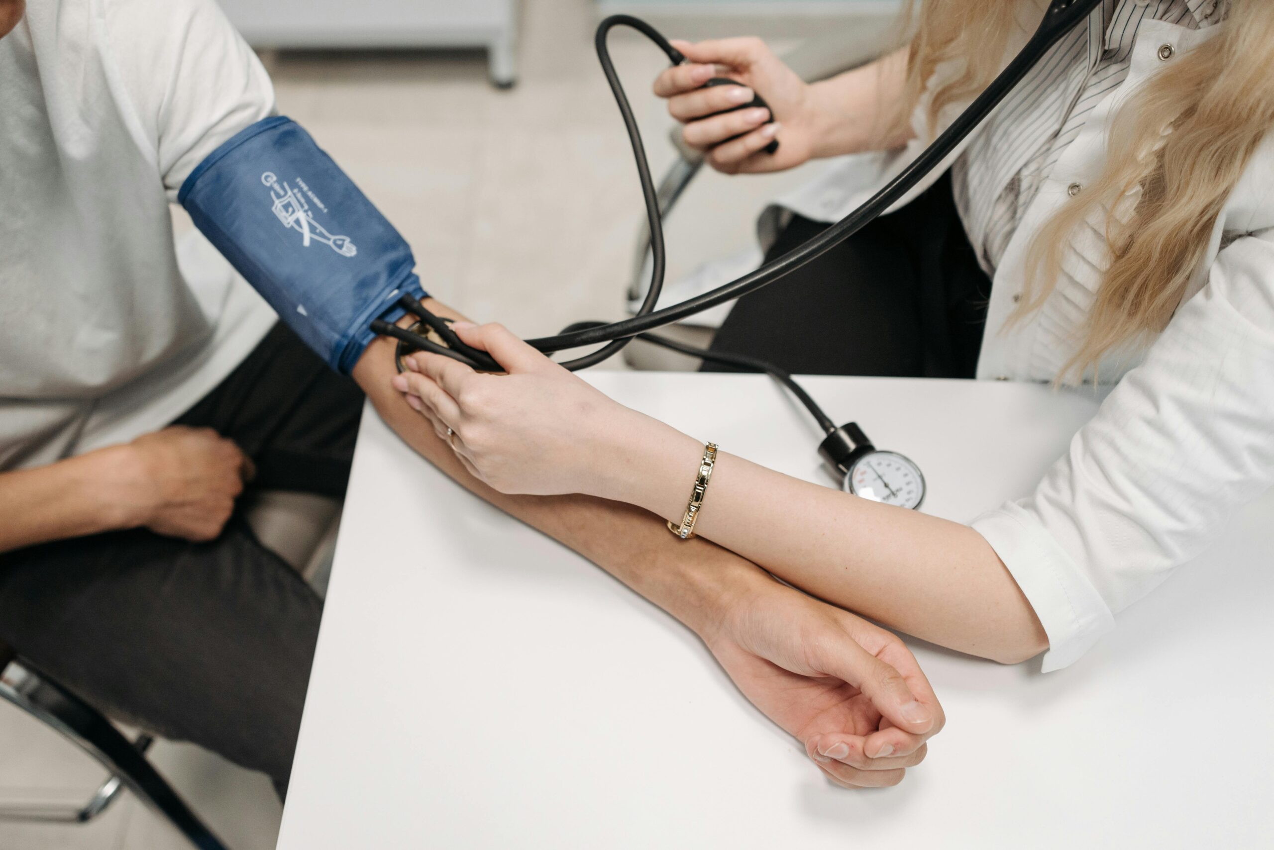 A doctor is measuring blood pressure